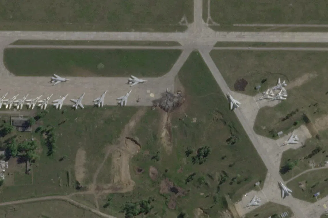 FILE PHOTO: A satellite view shows military aircraft, some sitting destroyed, at the Belaya air base, near Stepnoy, Irkutsk region, Russia, June 4, 2025, after Ukraine launched a drone attack, dubbed \"Operation Spider's Web\", targeting Russian strategic bombers during Russia's ongoing invasion of Ukraine. 2025 Planet Labs PBC/Handout via REUTERS/File Photo