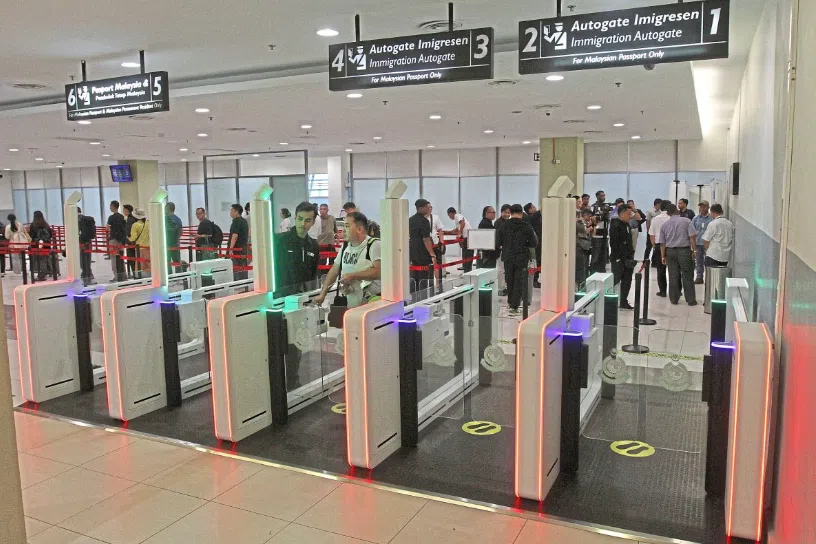 Malaysians using the newly installed NIISe autogates at Penang International Airport.