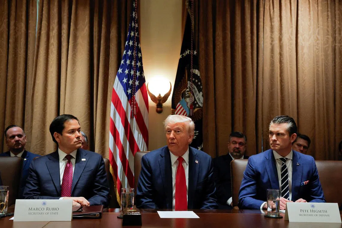 US President Donald Trump hosting the first Cabinet meeting of his new administration on Feb 26, flanked by Secretary of State Marco Rubio (left) and Defence Secretary Pete Hegseth.