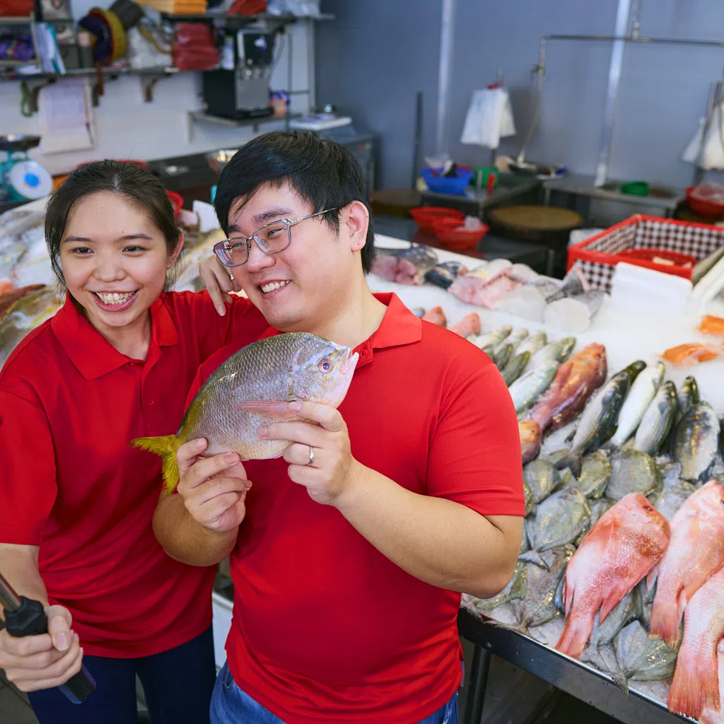 Second generation entrepreneurs Madeline Choo (left) and Jimmy Goh digitalized his family's 30-year-old fish business, turning Sin Chwee Mini Market into successful e-commerce platform Tankfully Fresh with Enterprise Singapore's support. PHOTO: SPH MEDIA 