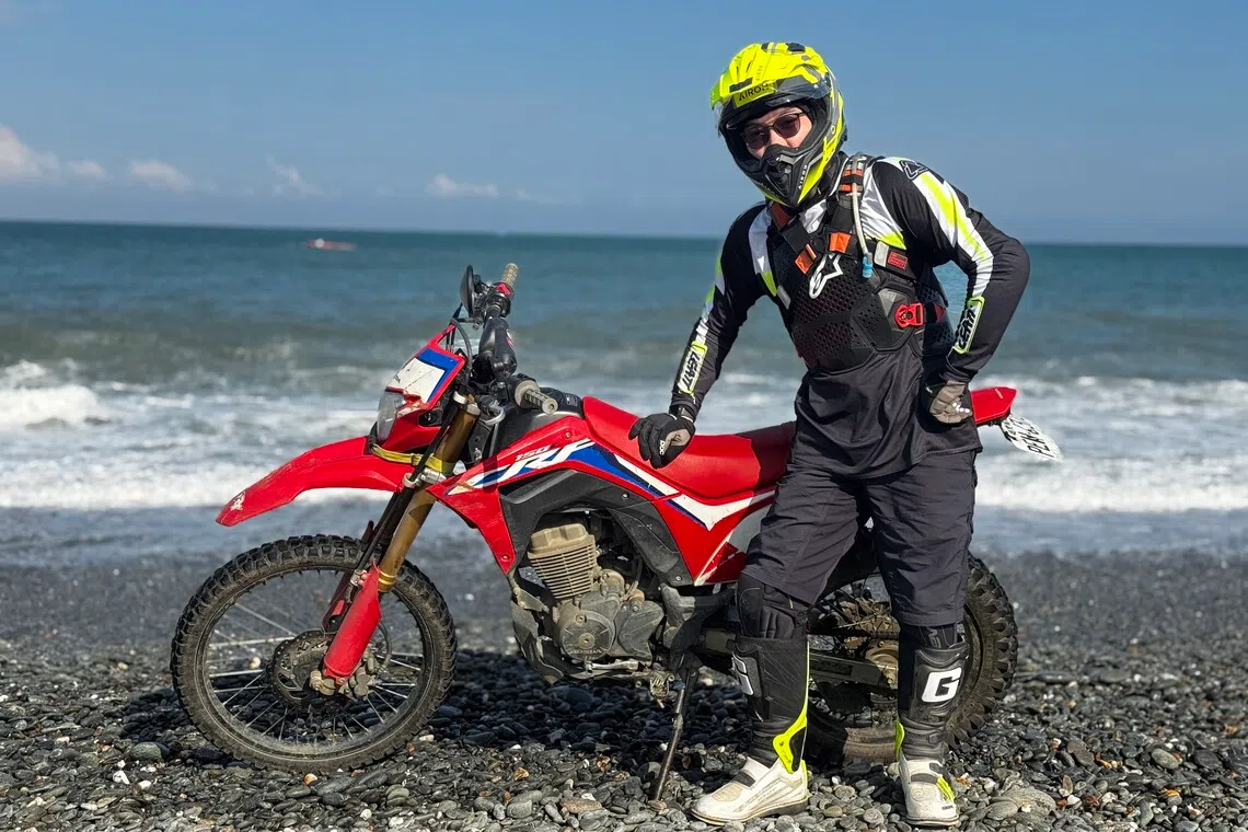 The writer riding at Dongao Bay, Taiwan.