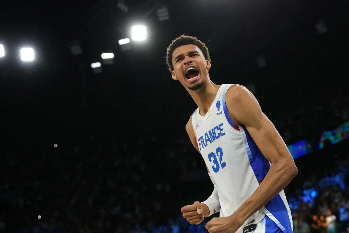 Paris 2024 Olympics - Basketball - Men's Semifinal - France vs Germany - Bercy Arena, Paris, France - August 08, 2024. Victor Wembanyama of France celebrates after France win the semifinal. REUTERS/Brian Snyder