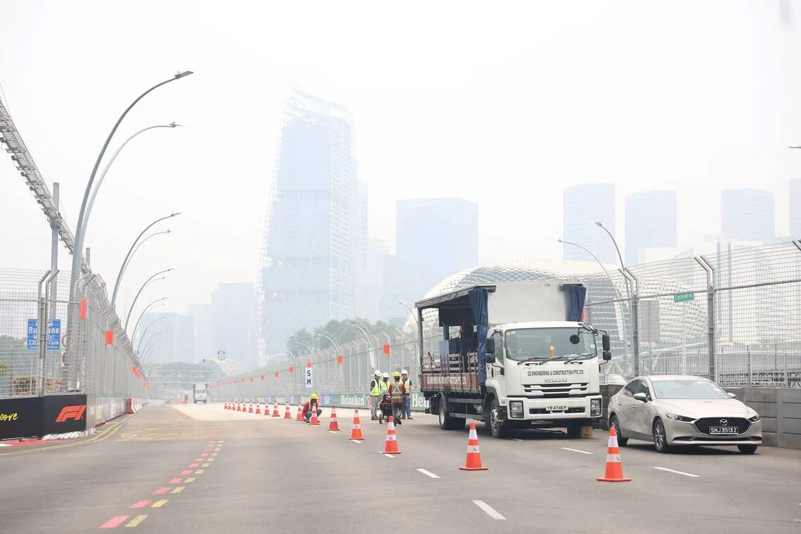 Hazy conditions seen on Esplanade Drive, Turn 13 of the Marina Bay Street Circuit, as road closures for the Formula One Singapore Grand Prix begins on Oct 7.