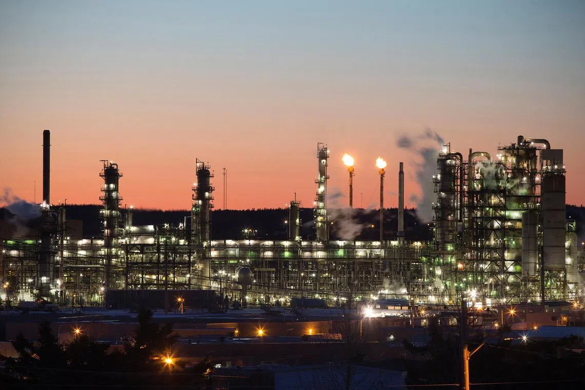 FILE PHOTO: The Irving Oil refinery is photographed at sunset on in Saint John, New Brunswick, March 9, 2014. The refinery, built by the Irving family in 1960, is the largest refinery in Canada and is the source of nearly one in three tanks of gasoline imported to the East Coast of the United States. Picture taken March 9, 2014.  REUTERS/Devaan Ingraham/File Photo