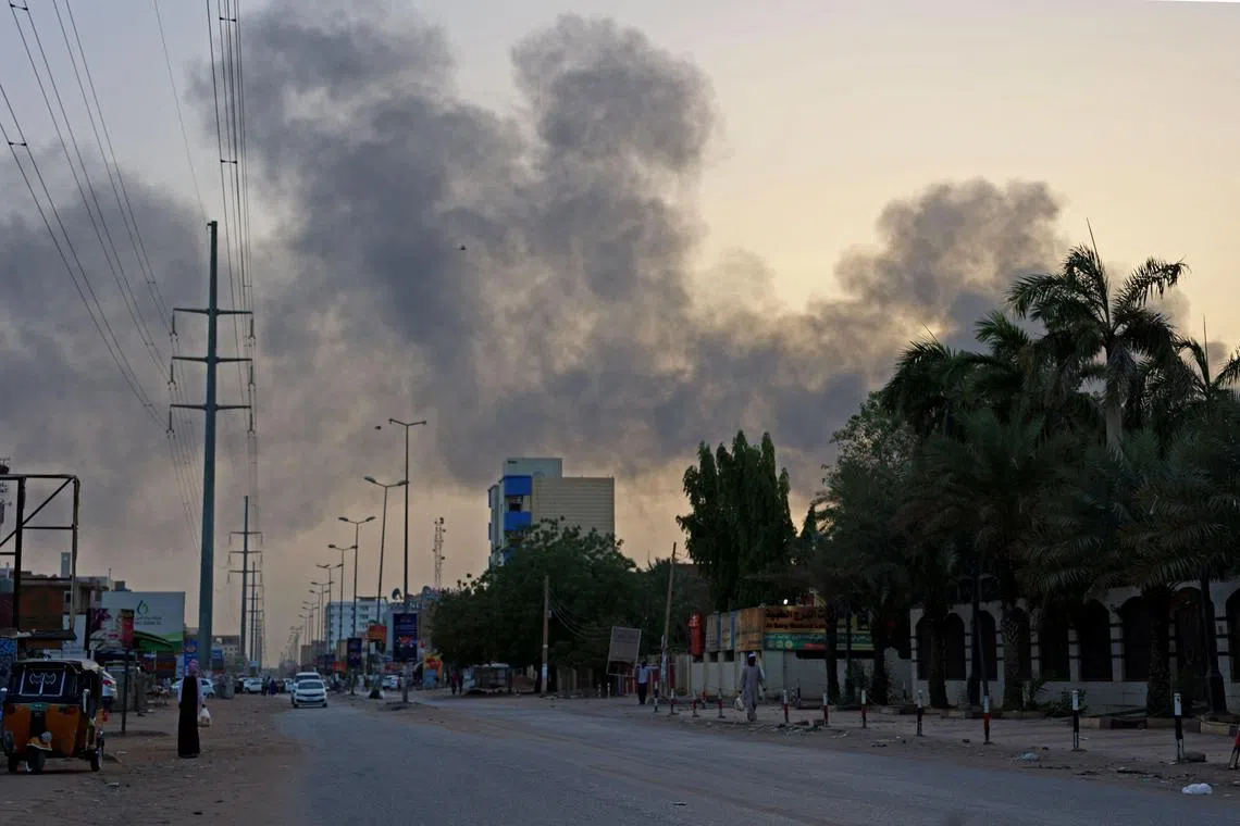 Smoke billows above residential buildings in east Khartoum, as fighting in Sudan raged for a second day, in battles between rival generals.