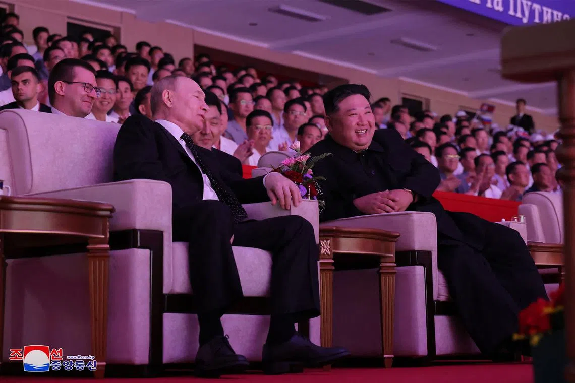 Russia's President Vladimir Putin and North Korea's leader Kim Jong Un watching a welcoming performance at the Pyongyang Gymnasium on June 19.