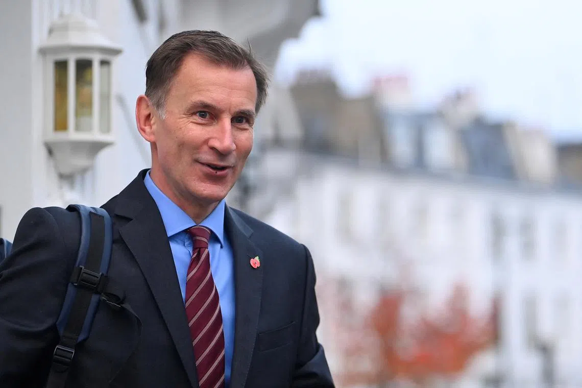 British Chancellor of the Exchequer Jeremy Hunt leaves his house in London, Britain, November 14, 2022. REUTERS/Toby Melville
