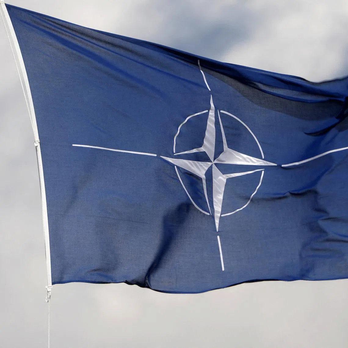 FILE PHOTO: A NATO flag flutters at the Tapa military base, Estonia April 30, 2023. REUTERS/Ints Kalnins/File Photo