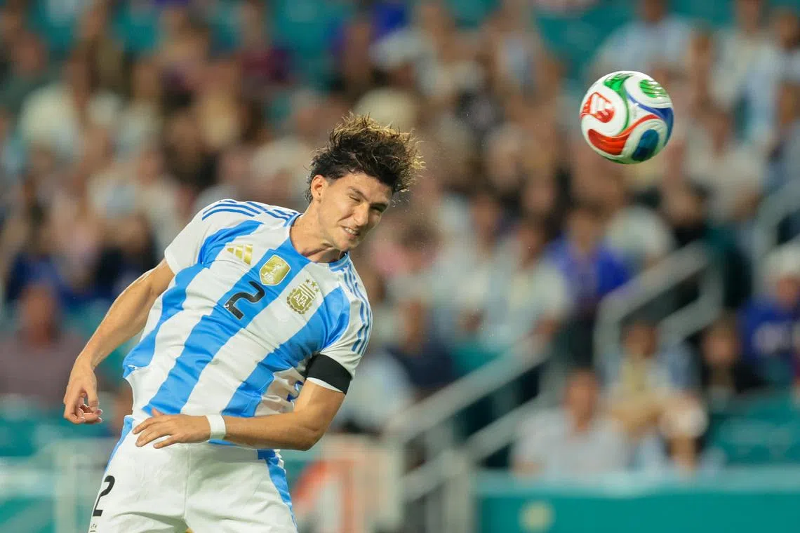 Oct 10, 2025; Miami Gardens, Florida, USA; Argentina defender Leonardo Balerdi (2) hits a header against Venezuela during the second half at Hard Rock Stadium. Mandatory Credit: Sam Navarro-Imagn Images
