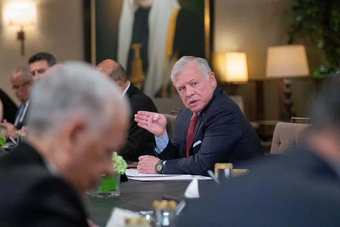 Jordan's King Abdullah II speaks during his meeting with officials in Amman, Jordan in this handout picture released on November 13, 2023. Royal Hashemite Court/Handout via Reuters