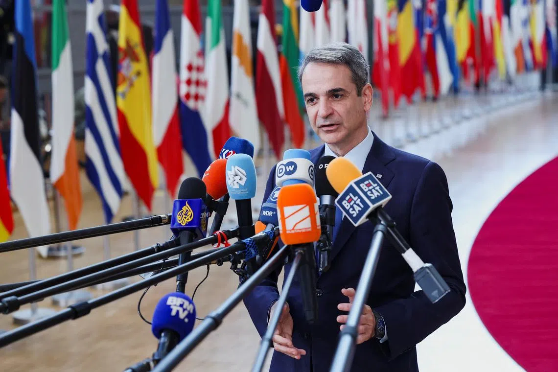 Greek Prime Minister Kyriakos Mitsotakis talks to the press as he attends a European Union summit in Brussels, Belgium March 20, 2025. REUTERS/Yves Herman