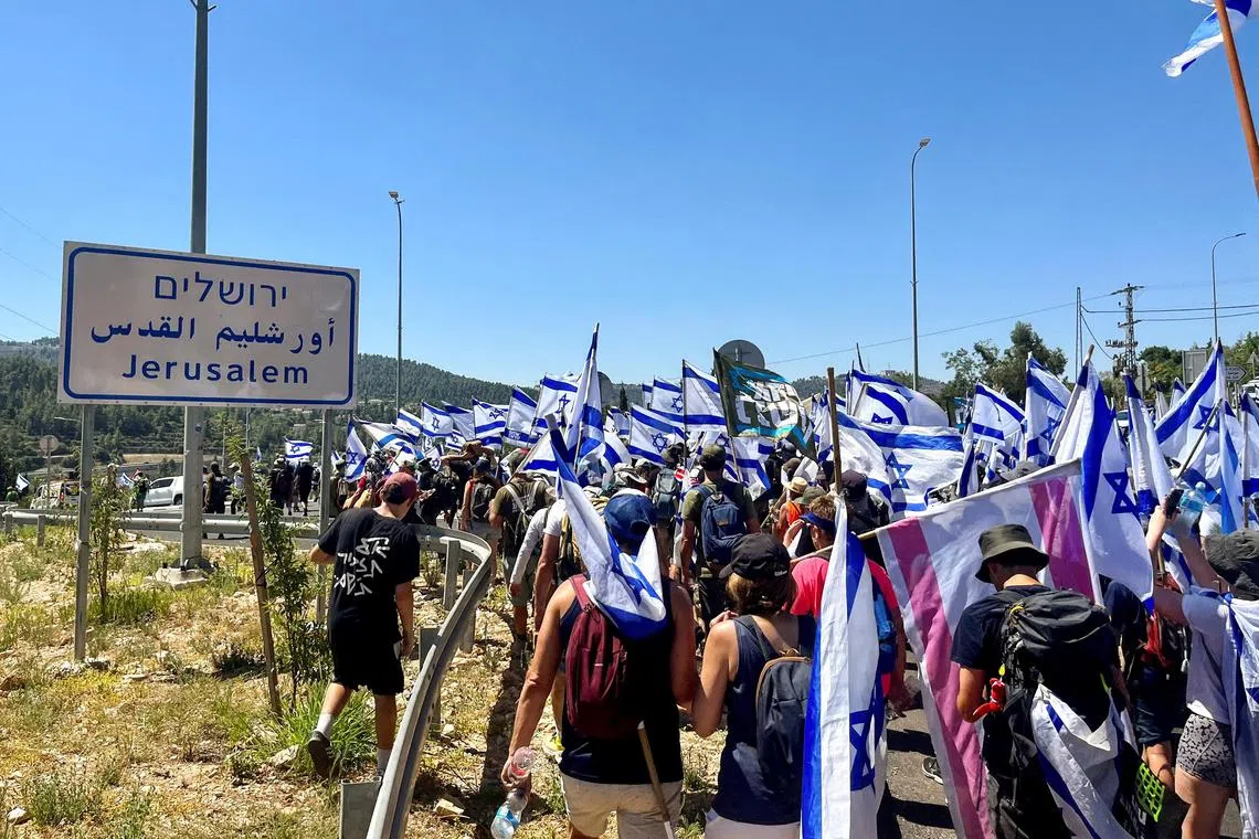 Protesters marching against Israeli PM Benjamin Netanyahu's judicial overhaul, at the entrance to Jerusalem on July 22, 2023.