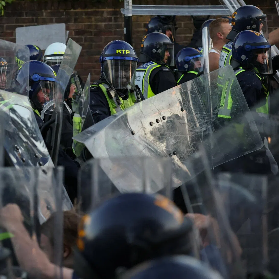 Protesters clash with police officers during a demonstration following the conviction of Vikrum Digwa for the murder of student Henry Nowak, in Southampton, Britain, June 2.