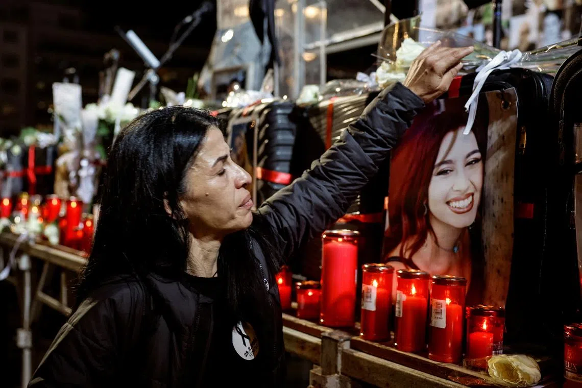 FILE PHOTO: A relative leaves a flower during a demonstration over last February's deadly train crash, in front of the Greek parliament, in Athens, Greece, December 12, 2023. REUTERS/Louisa Gouliamaki/File Photo