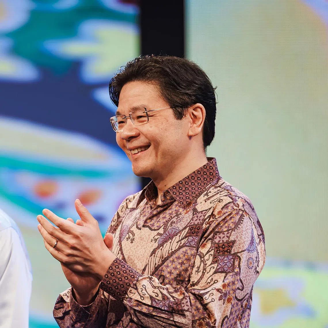 Prime Minister Lawrence Wong (right)  said the Government will continue to support efforts to promote the Malay language and culture.