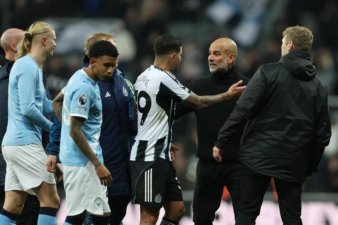 Newcastle United's Bruno Guimaraes clashes with Manchester City manager Pep Guardiola after the match.