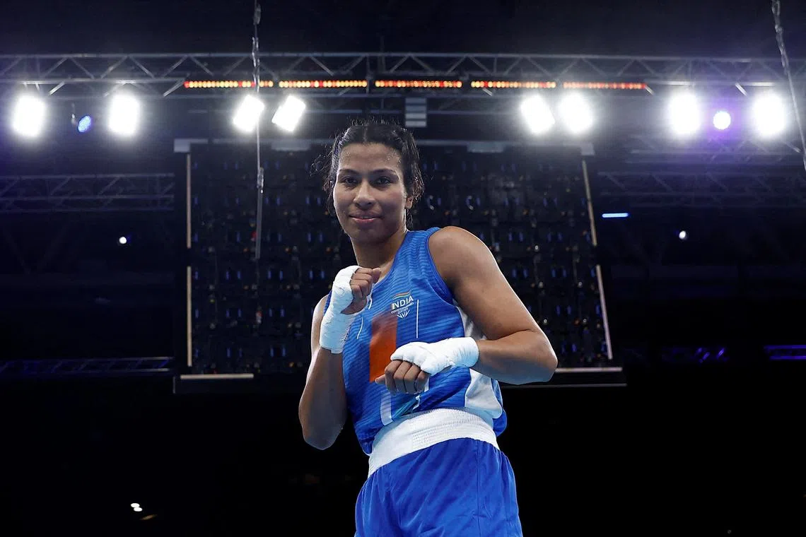FILE PHOTO: Commonwealth Games - Boxing - Men's Over 66-71kg (Light Middleweight) - Round of 16 - The NEC Hall 4, Birmingham, Britain - July 30, 2022 India's Lovlina Borgohain celebrates after winning her fight against New Zealand's Ariane Nicholson REUTERS/Jason Cairnduff/File Photo