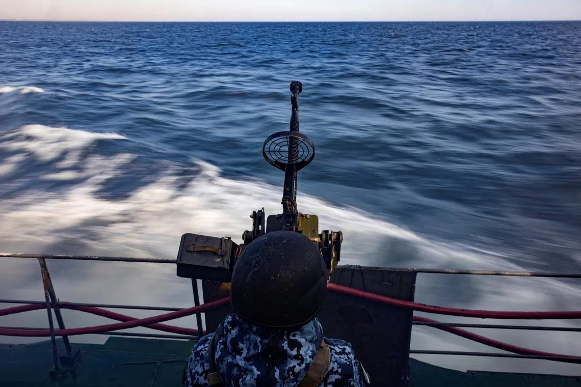 A Ukrainian serviceman manning a gun on a patrol boat in the Black Sea, amid Russia’s invasion of Ukraine, in February 2024.