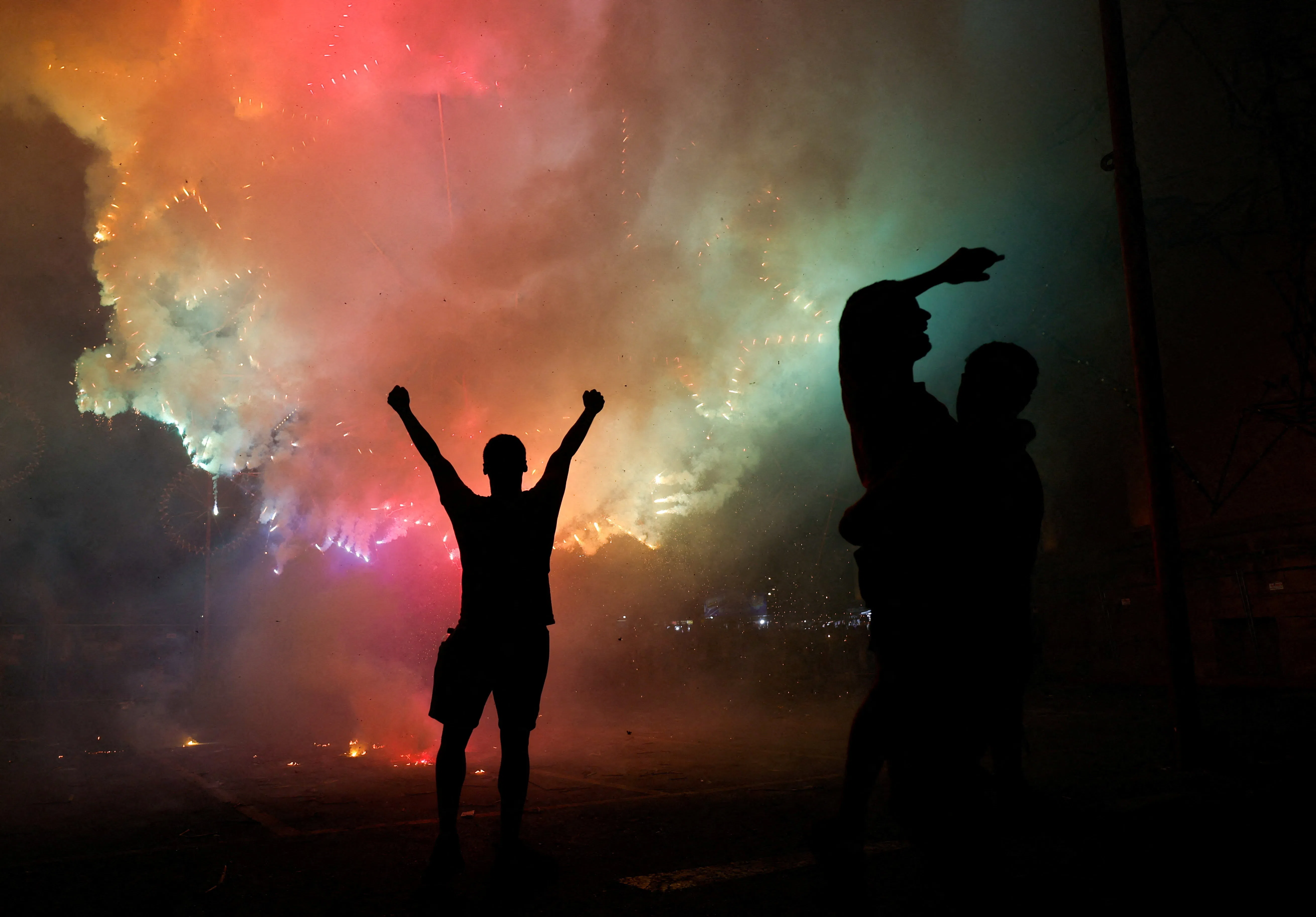 Enthusiasts celebrate in front of a mechanised ground fireworks display during celebrations marking the feast of the Assumption of Our Lady in Mosta, Malta, August 15, 2026. REUTERS/Darrin Zammit Lupi     TPX IMAGES OF THE DAY