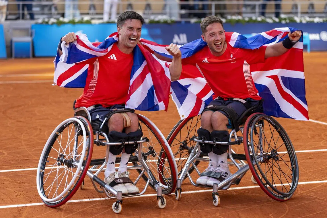 Gordon Reid (left) and Alfie Hewett celebrate after winning gold in the tennis wheelchair doubles at the Paris Paralympics.