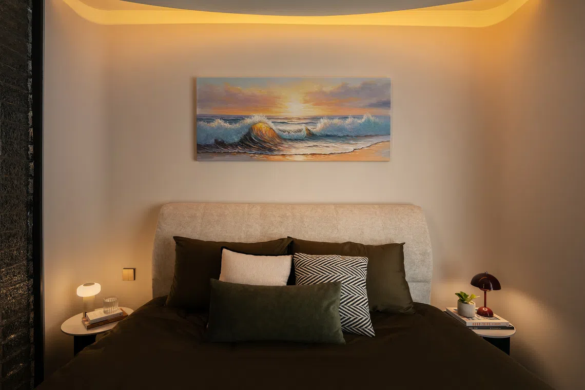 A curved ceiling detail and warm cove lighting transform the master bedroom into a cocoon-like zone.  