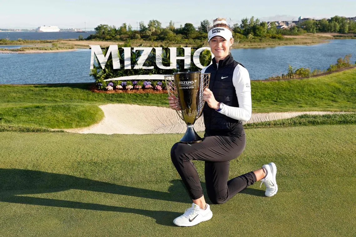 Nelly Korda posing with the trophy after winning the Mizuho Americas Open on May 19.