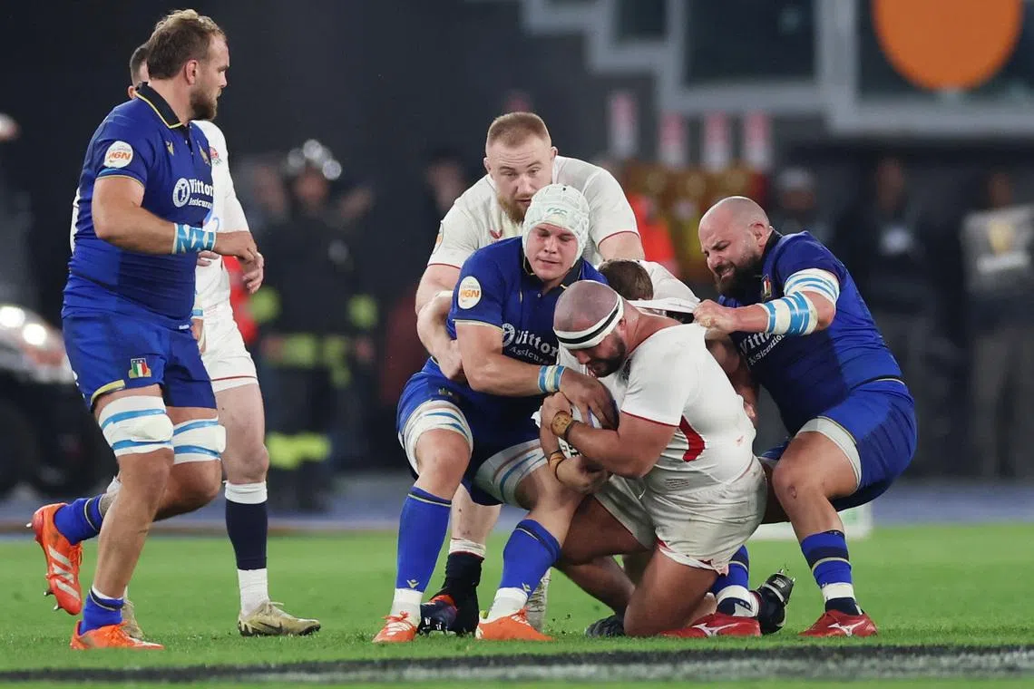 FILE PHOTO: Rugby Union - Six Nations Championship - Italy v England - Stadio Olimpico, Rome, Italy - March 7, 2026 Italy's Simone Ferrari and Manuel Zuliani in action with England's Ellis Genge REUTERS/Ciro De Luca/ File Photo