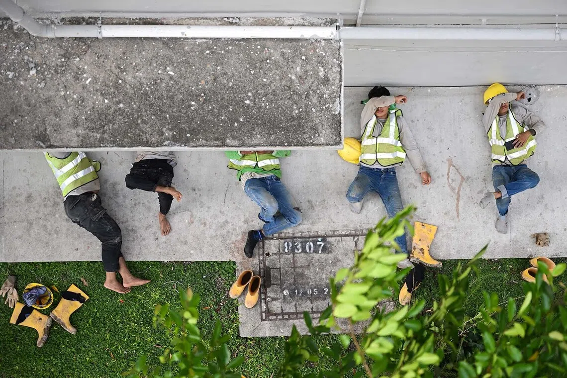 Construction workers resting at Kitchener Road, Singapore, during the afternoon of Nov 26, 2025.