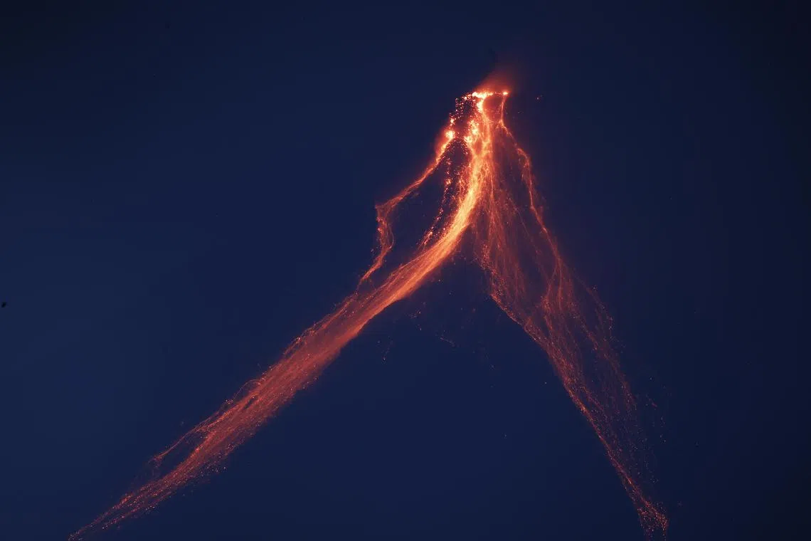 Mayon Volcano spewing  ashes and lava as seen from Legaspi city, Albay province, Philippines on 14 June 2023. Lava started to flow toward villages and ash rained houses in the Mayon volcano danger zone, according to fleeing villagers.  