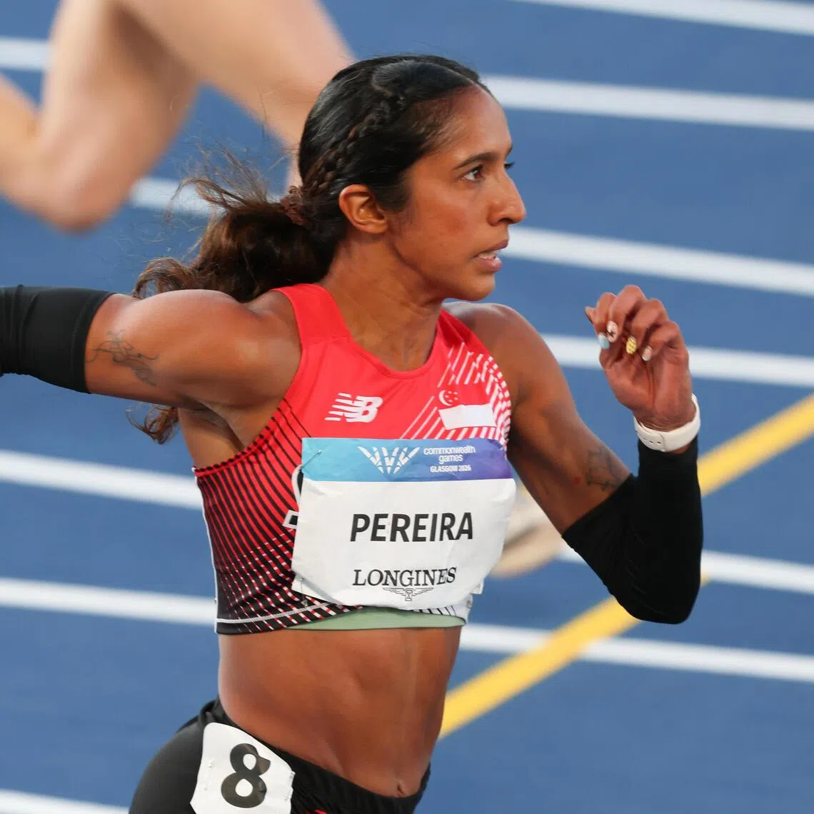 Shanti Pereira in full stride at the Commonwealth Games where she became the first Singaporean to make the 200m final.