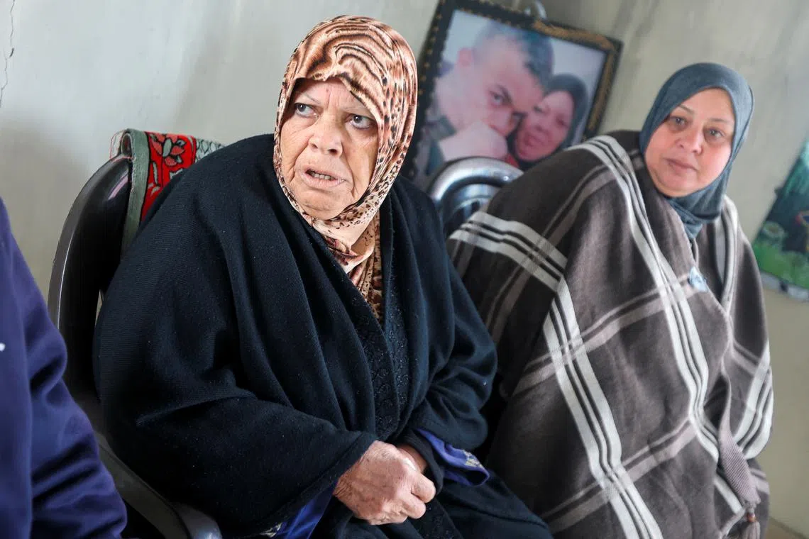 Najat El Agha, the mother of Palestinian prisoner Diaa El Agha, who was supposed to be released on Saturday as part of a hostages-prisoners swap deal between Hamas and Israel under a Gaza ceasefire deal, looks on, in Khan Younis, southern Gaza Strip, February 24, 2025. REUTERS/Ramadan Abed