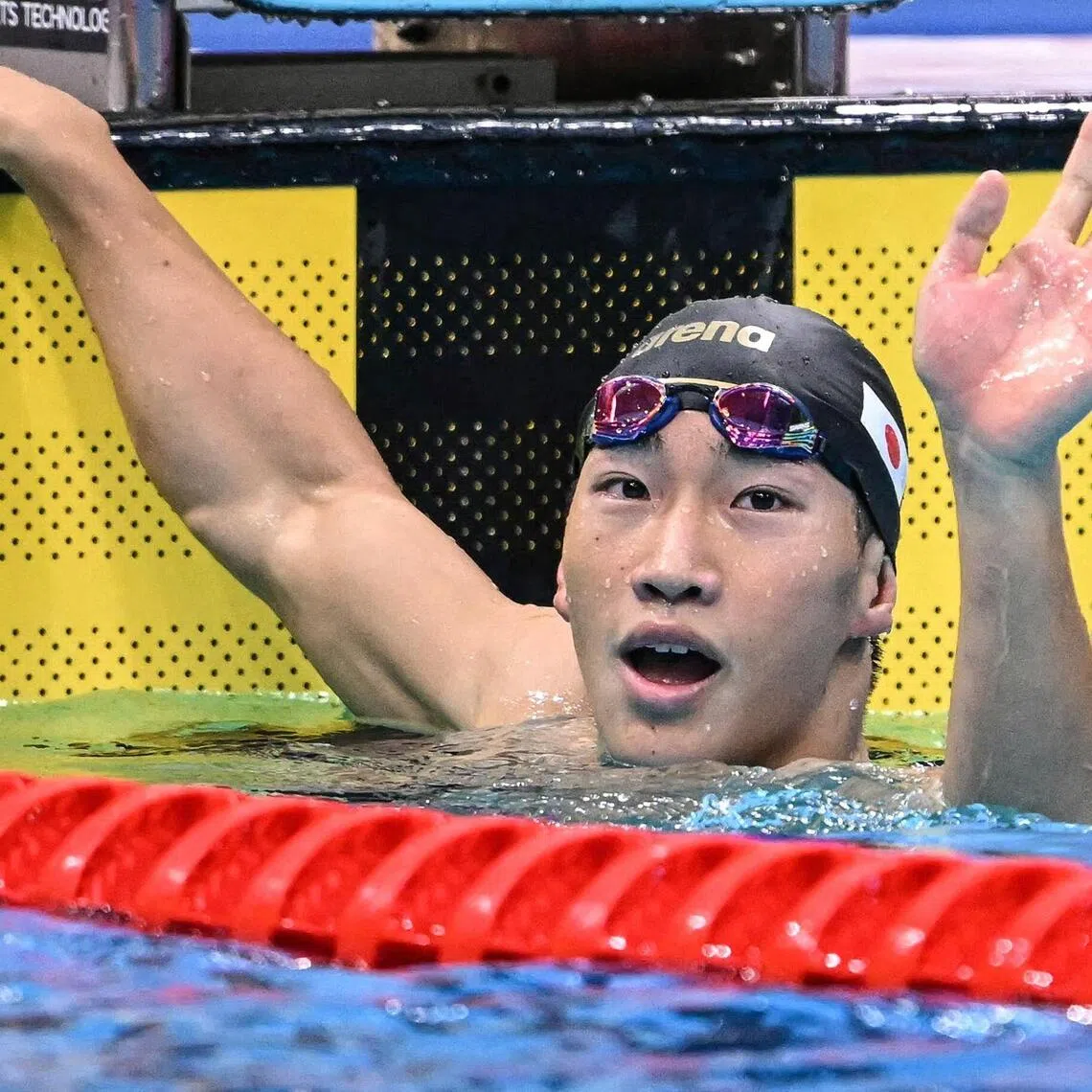 Japan’s Shin Ohashi celebrates after breaking the world record in the men’s 200m breaststroke at the Asian Games.