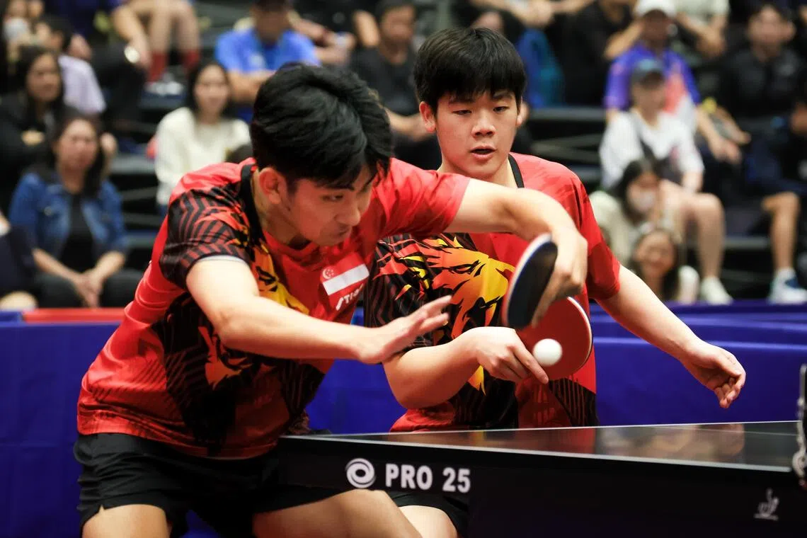 Koen Pang (left) and Zeng Jian helped Singapore reclaim the SEA Games mixed doubles gold on Dec 17.