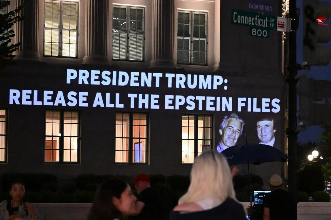 A message calling on President Donald Trump to release all files related to Jeffrey Epstein is projected onto the US Chamber of Commerce building across in Washington, DC, on July 18.