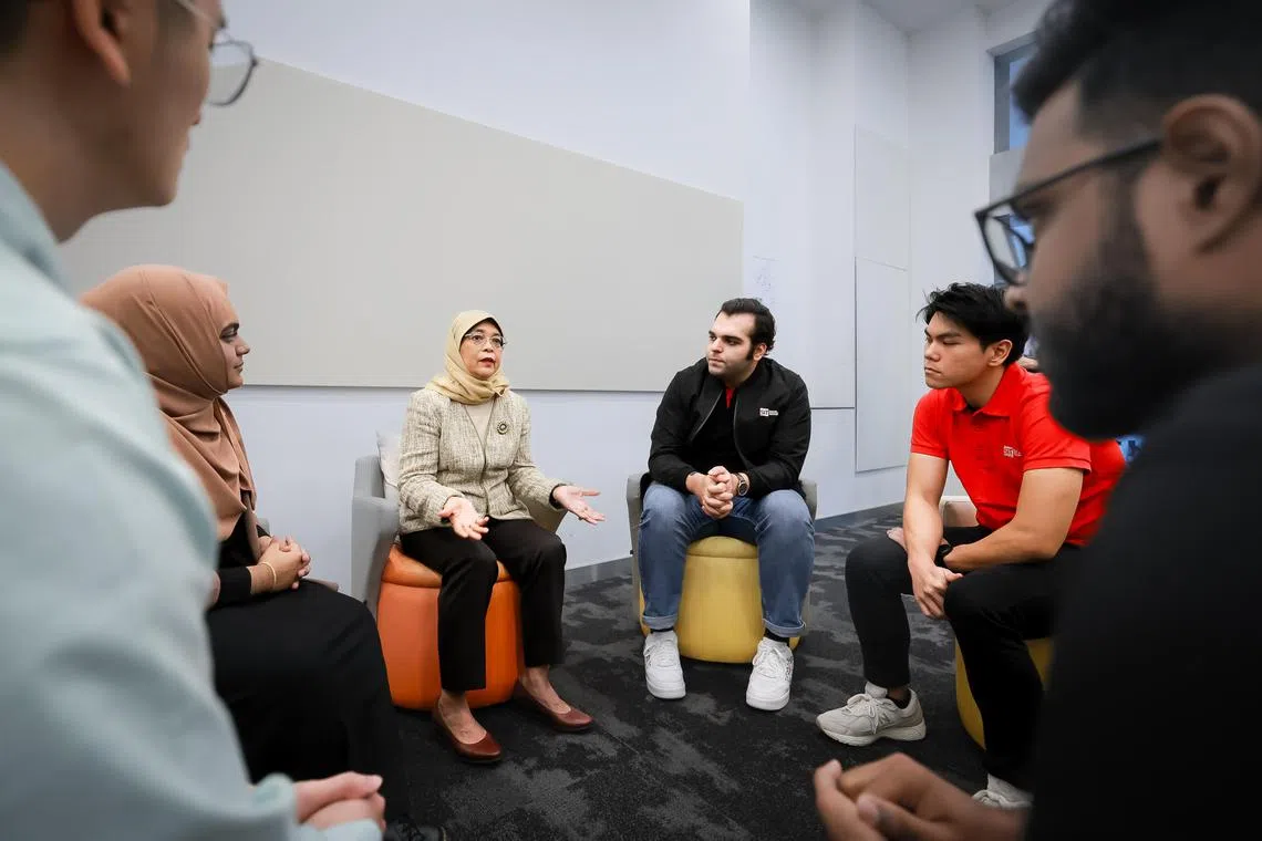 President Halimah Yacob interacting with Singapore Institute of Technology (SIT) students during a visit to the campus at Dover Road, June 28, 2023.