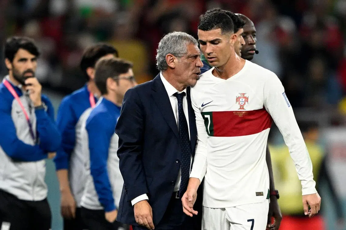 Portugal coach Fernando Santos with Cristiano Ronaldo as he leaves the pitch during the 2-1 defeat to South Korea on Dec 2.