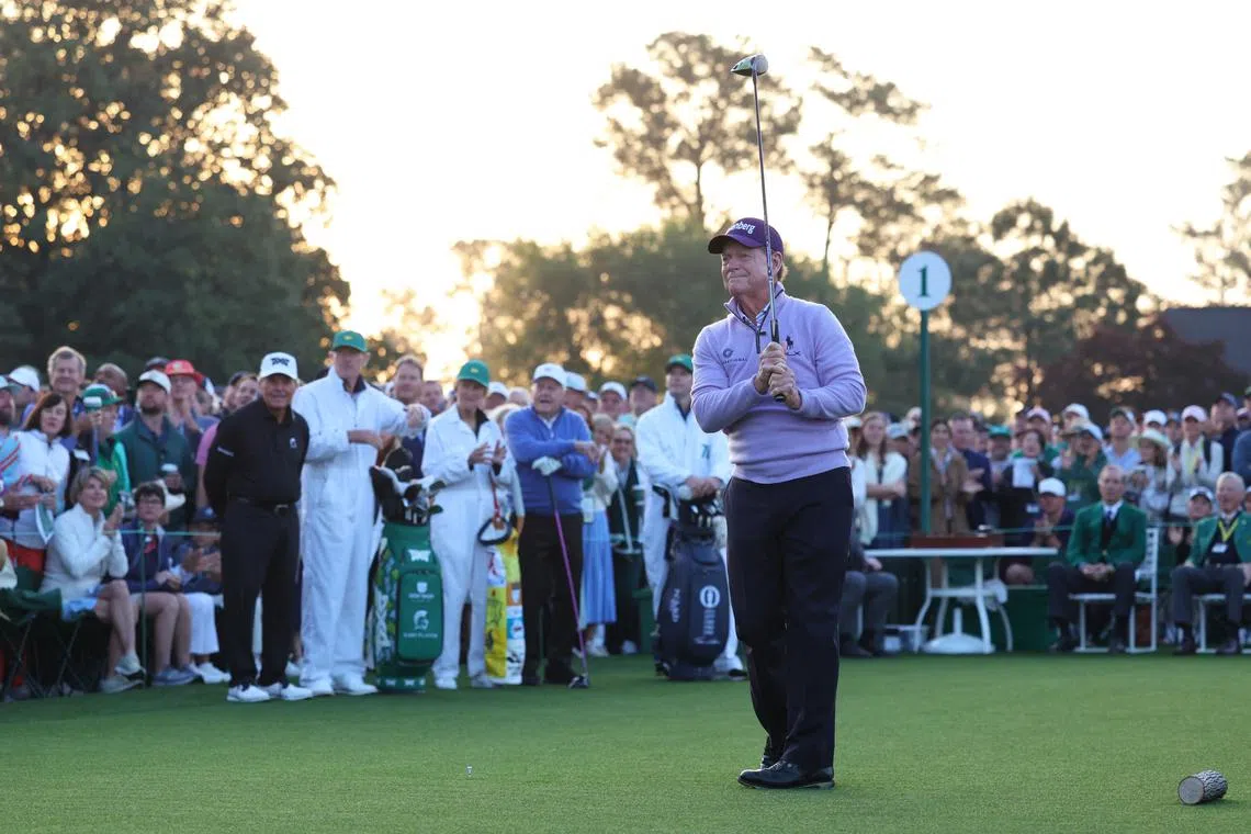 Golf - The Masters - Augusta National Golf Club, Augusta, Georgia, U.S. - April 10, 2025  Tom Watson of the U.S. hits his tee shot during the ceremonial tee off as South Africa's Gary Player and Jack Nicklaus of the U.S. look on REUTERS/Mike Segar