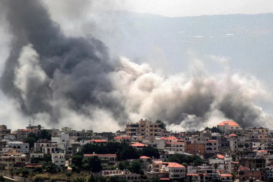 Smoke billows during Israeli bombardment on the village of Khiam in south Lebanon near the border with Israel, on June 8, 2024.