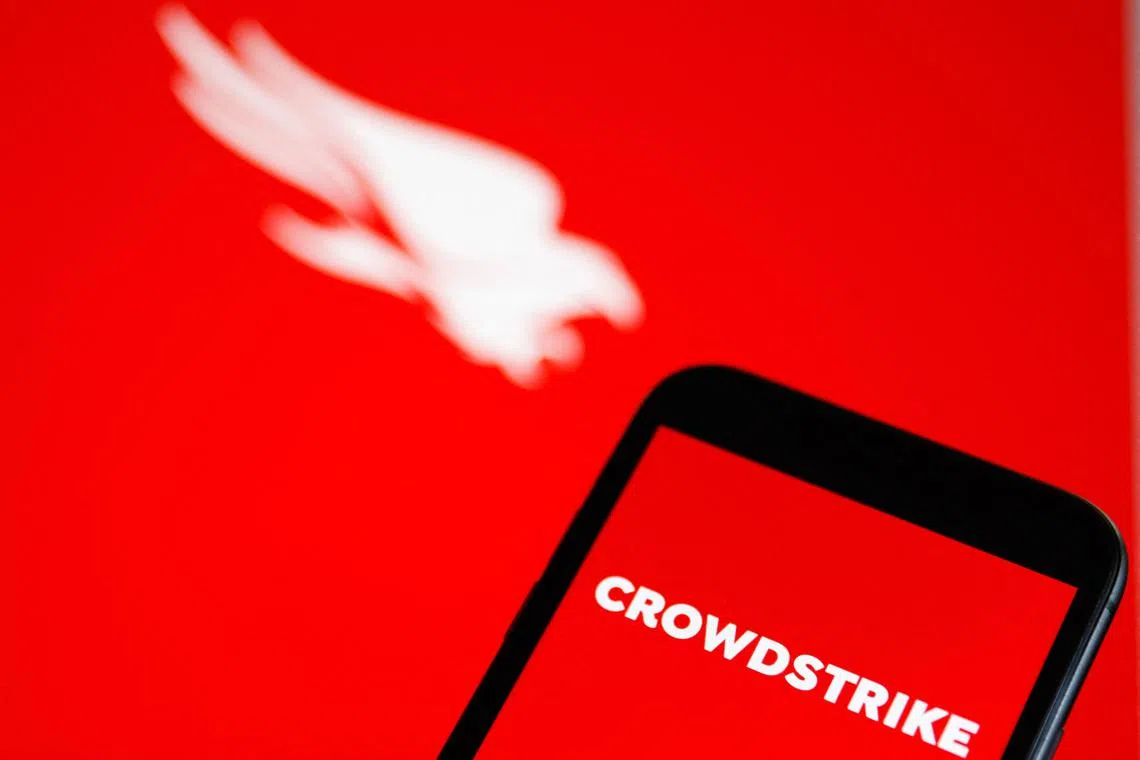 This photograph shows a screen displaying a logo of "CrowdStrike" cybersecurity technology company in Munich on July 19, 2024, amid massive global IT outage. Airlines, banks, TV channels and other business across the globe were scrambling to deal with one of the biggest IT crashes in recent years on July 19, 2024, caused by an update to an antivirus program. (Photo by Michaela STACHE / AFP)