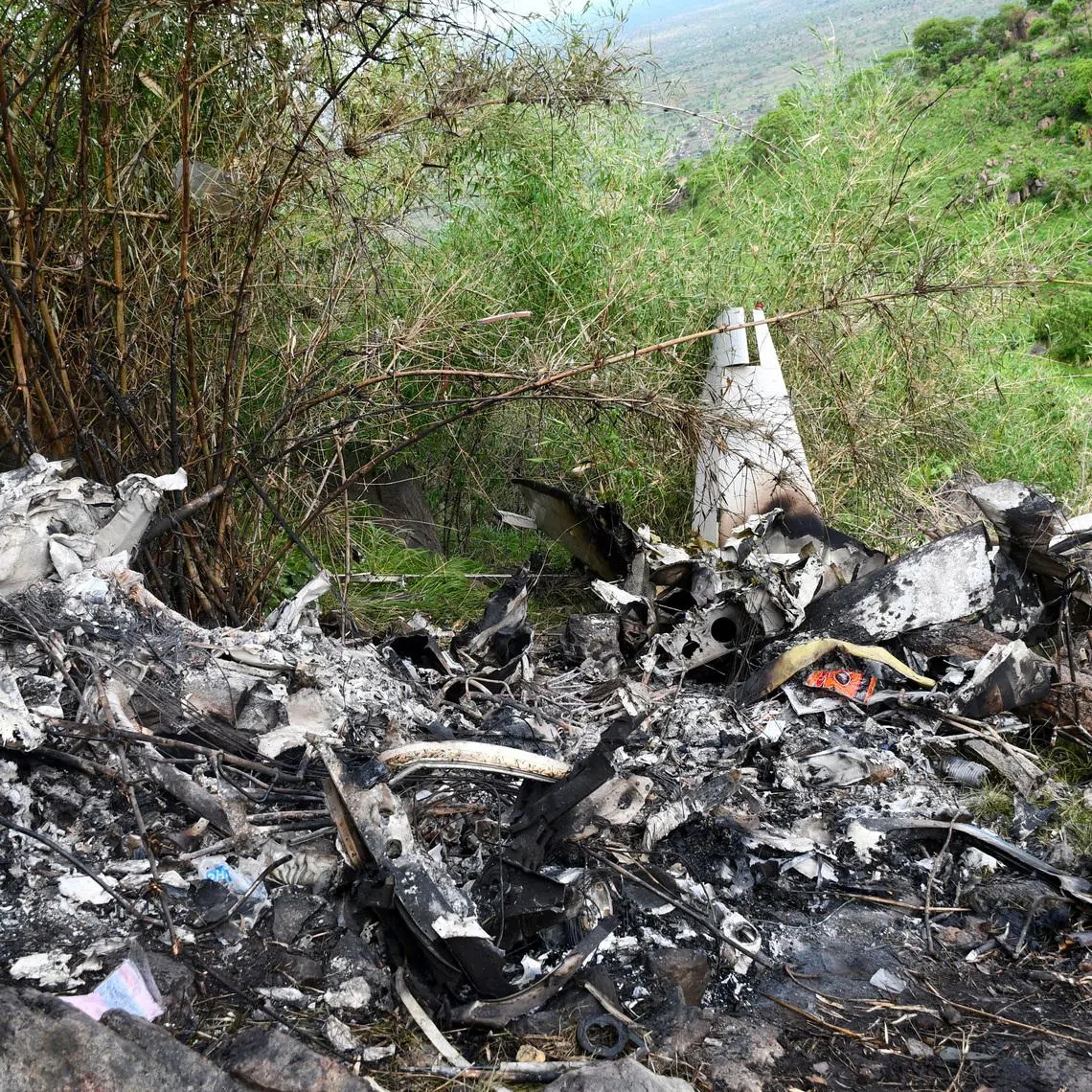 A member of the South Sudan Red Cross walks at the wreckage of a Cessna 208 Caravan operated by CityLink Aviation, that lost communication and crashed while flying from Yei to Juba International Airport, in Juba, South Sudan April 27, 2026. REUTERS/Samir Bol