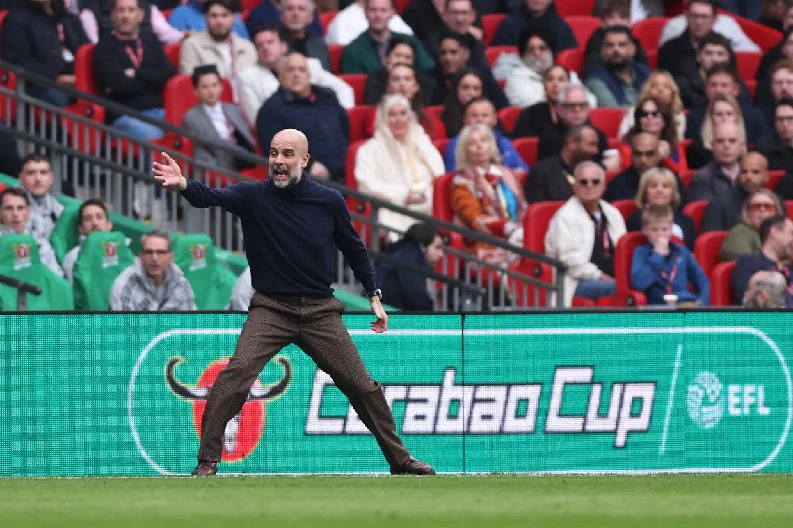 Soccer Football - Carabao Cup - Final - Arsenal v Manchester City - Wembley Stadium, London, Britain - March 22, 2026 Manchester City manager Pep Guardiola reacts REUTERS/David Klein EDITORIAL USE ONLY. NO USE WITH UNAUTHORIZED AUDIO, VIDEO, DATA, FIXTURE LISTS, CLUB/LEAGUE LOGOS OR 'LIVE' SERVICES. ONLINE IN-MATCH USE LIMITED TO 120 IMAGES, NO VIDEO EMULATION. NO USE IN BETTING, GAMES OR SINGLE CLUB/LEAGUE/PLAYER PUBLICATIONS. PLEASE CONTACT YOUR ACCOUNT REPRESENTATIVE FOR FURTHER DETAILS..