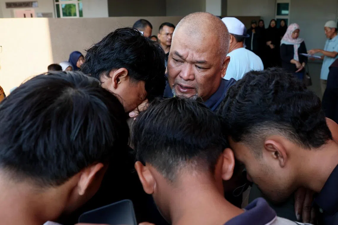 A sad atmosphere enveloped the grounds of the Dungun Hospital Forensic Department when family members and friends of three Dungun University of Technology Mara (UiTM) students who died in a road accident involving two motorcycles and a car on Jalan Pantai Sura last night earlier, gathered this morning.