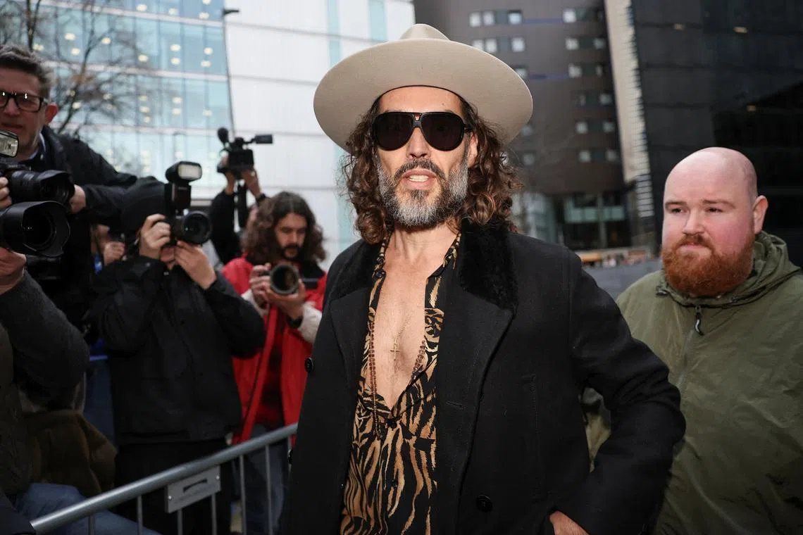 British actor and comedian Russell Brand arrives at Southwark Crown Court after further charges were added to his rape and multiple sexual assault case, in London, Britain, February 24, 2026. REUTERS/Toby Melville