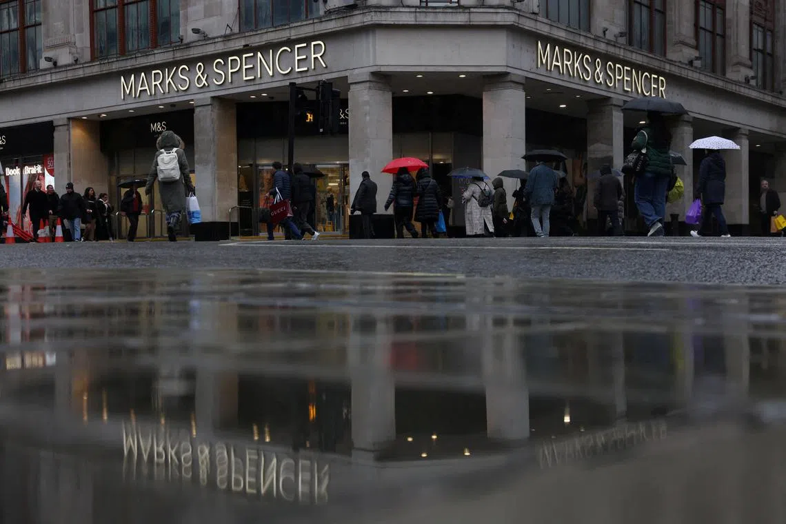 FILE PHOTO: Pedestrians walk past the Marks & Spencer store near Marble Arch on Oxford Street, in London, Britain, February 29, 2024. REUTERS/Hollie Adams/File Photo