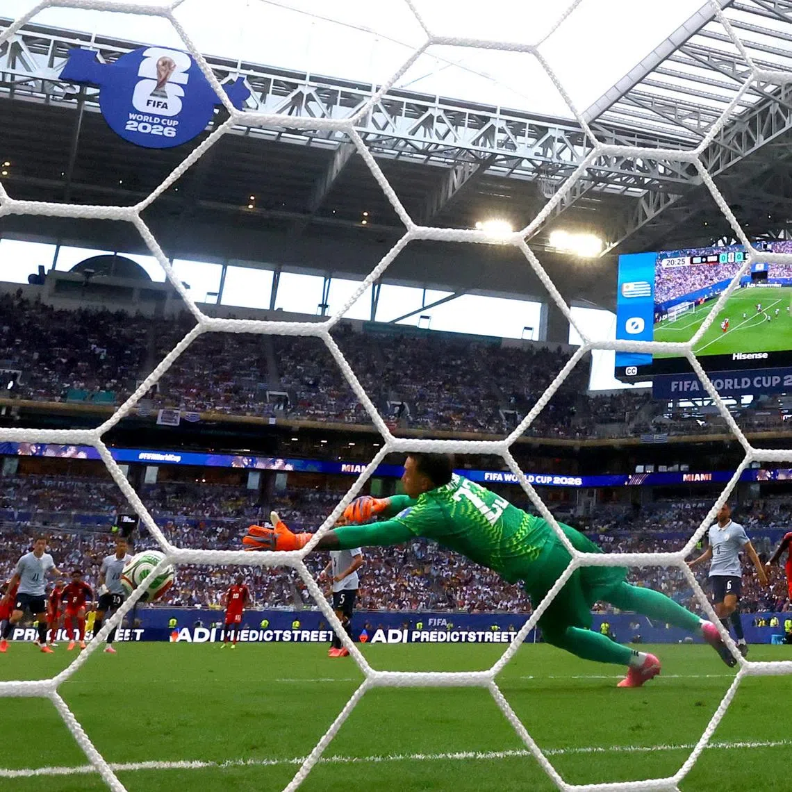 Soccer Football - FIFA World Cup 2026 - Group H -  Uruguay v Cape Verde - Miami Stadium, Miami Gardens, Florida, U.S. - June 21, 2026 Cape Verde's Kevin Pina scores their first goal past Uruguay's Fernando Muslera REUTERS/Amanda Perobelli