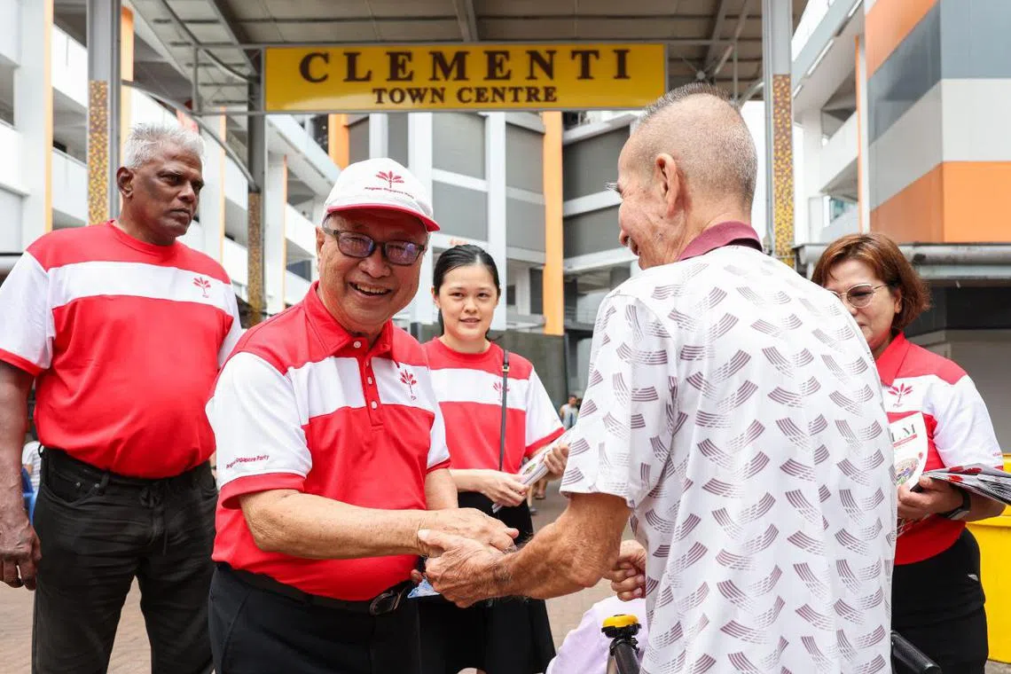 Progress Singapore Party chairman Tan Cheng Bock (second from left) greeting Clementi residents during his party's walkabout at Clementi Central on Feb 23.