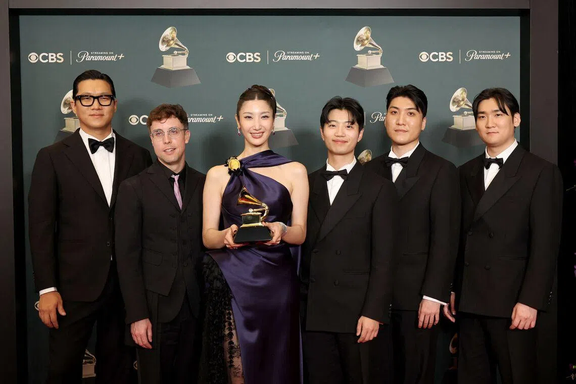 The team from animated film KPop Demon Hunters with the award for Best Song Written for Visual Media for Golden at the Grammy Awards on Feb 1.