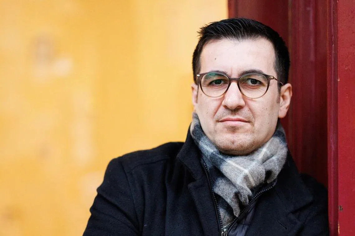 Jian Omar, a German politician of Kurdish-Syrian background, poses in front of his constituency office that has been attacked three times since October 7, amid the ongoing conflict between Israel and the Palestinian Islamist group Hamas, in Berlin, Germany, November 27, 2023. REUTERS/Lisi Niesner