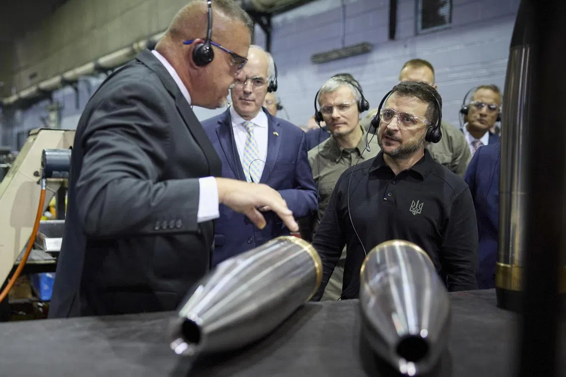 Ukrainian President Volodymyr Zelensky (right) visiting an ammunition plant in Scranton, Pennsylvania, on Sept 23, where he thanked workers for the shells that are helping to defend Ukraine against Russia's invasion.