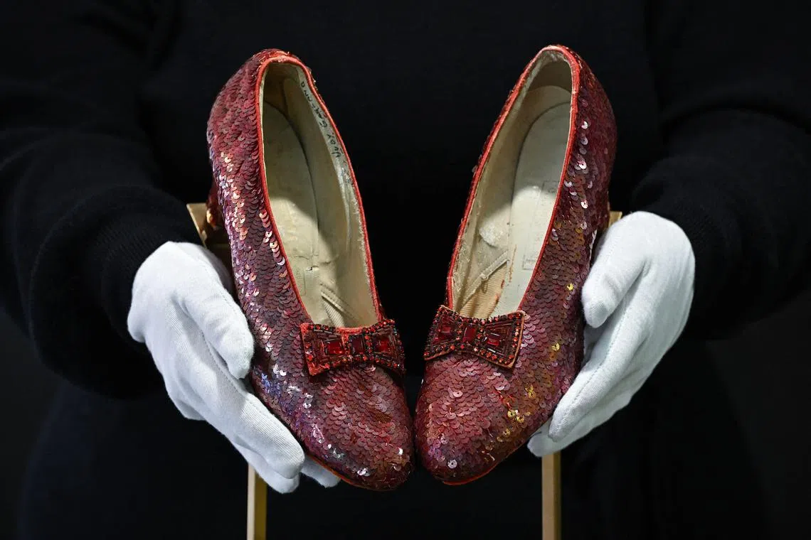 The ruby slippers worn by US actress and singer Judy Garland in the 1939 film The Wizard of Oz are pictured on display in London on November 27, 2024. The shoes will be sold at auction on December 7, 2024, with predictions they could sell for up to $3 million. (Photo by Justin TALLIS / AFP)